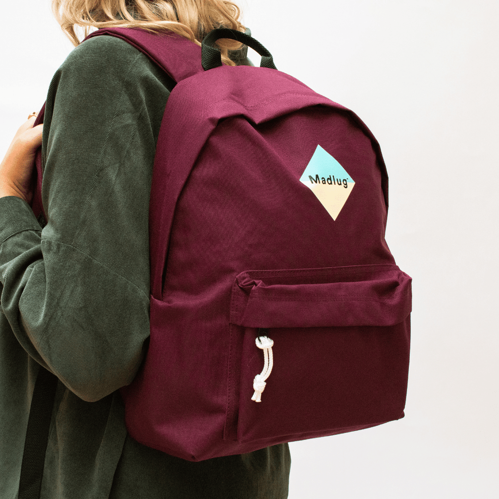 Madlug Classic Backpack in Burgundy. Female model rear view.