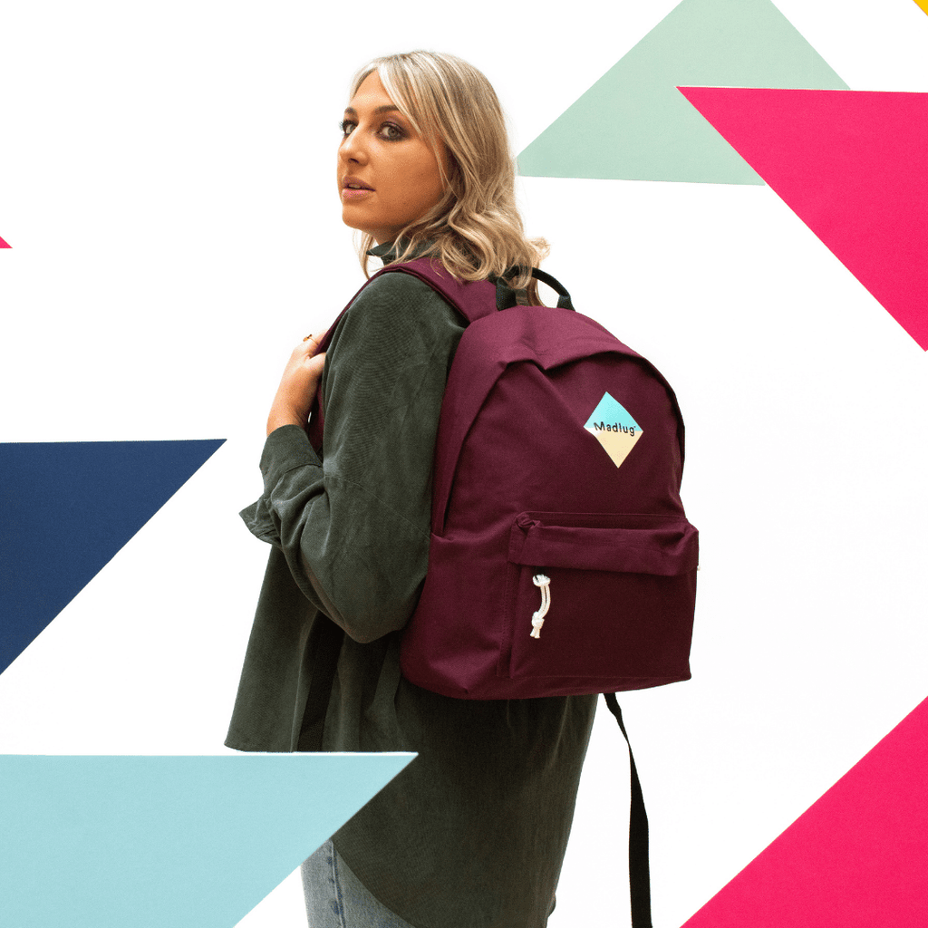 Madlug Classic Backpack in Burgundy. Female model rear view.