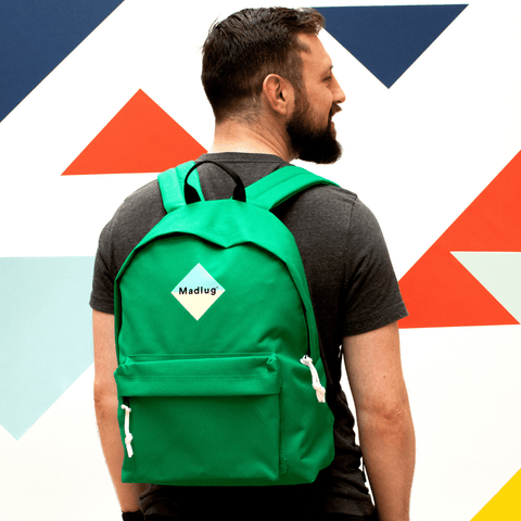 Madlug Classic Backpack in Green. Male model rear view.